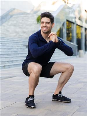 picture of a man doing a deep exercise  squat