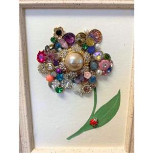 various jewels positioned in a flower shape.